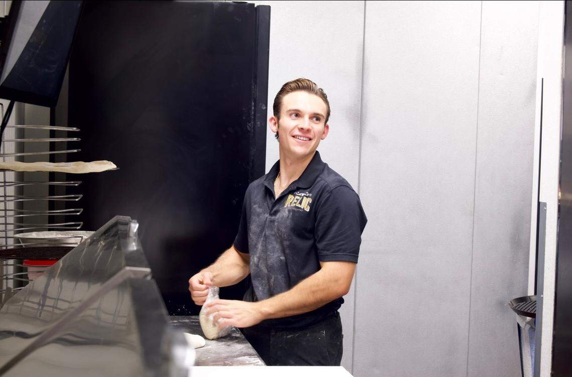 Jeremiah Willey makes a pizza. He and his family opened Gold Dust Pizza in El Dorado Hills on April 22.